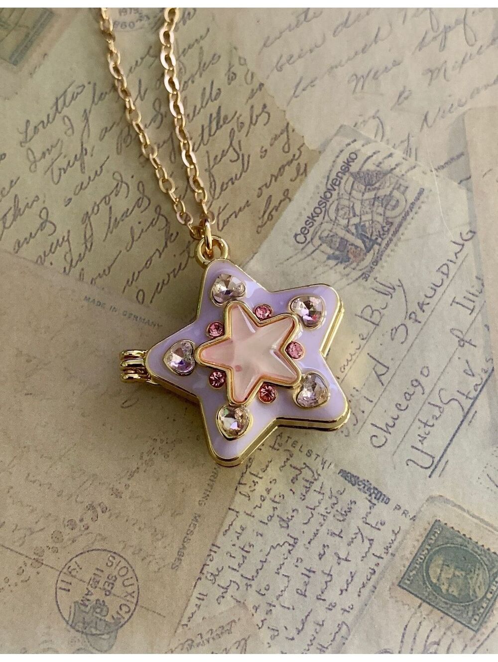 Star-Shaped Gold Pendant Necklace with Pink and Purple Accents Magnet Closure